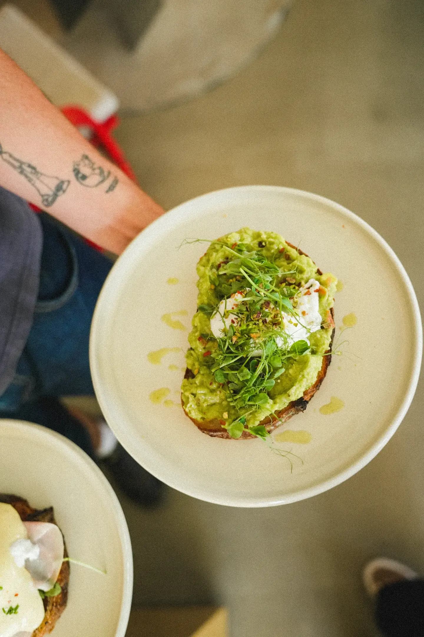 Avocado toast with egg and pea shoots